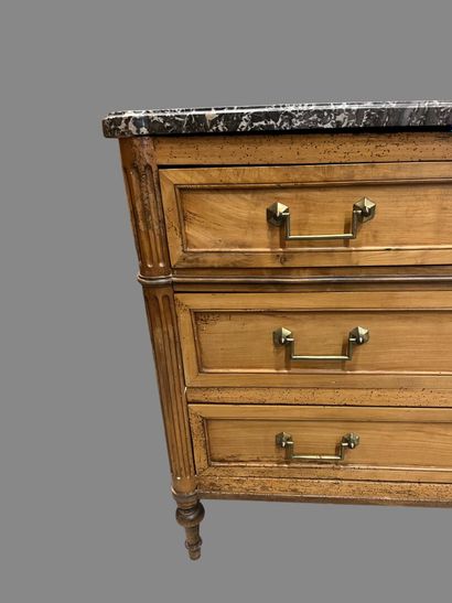 Light wood chest of drawers with three wide...