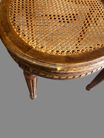 Three caned chairs in molded natural wood....