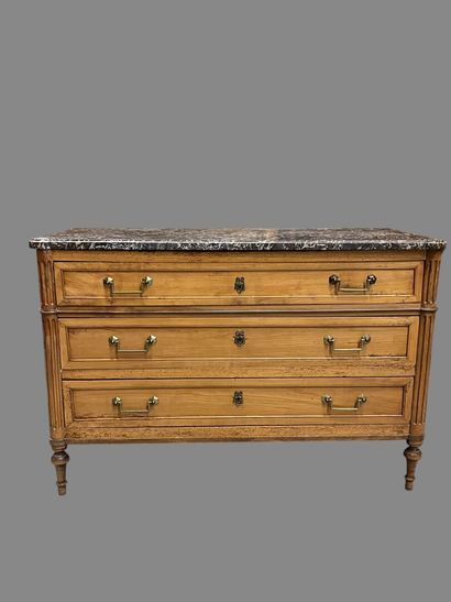 Light wood chest of drawers with three wide...