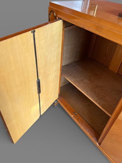 Light wood veneered sideboard opening to...