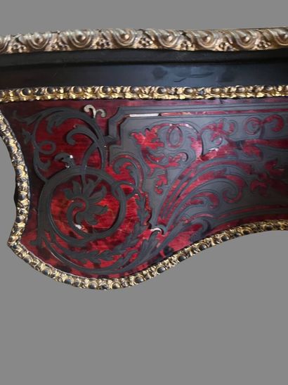 A Boulle-style red tortoiseshell veneered...