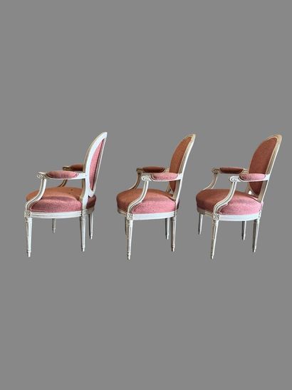 Suite of three white relacquered molded wood...