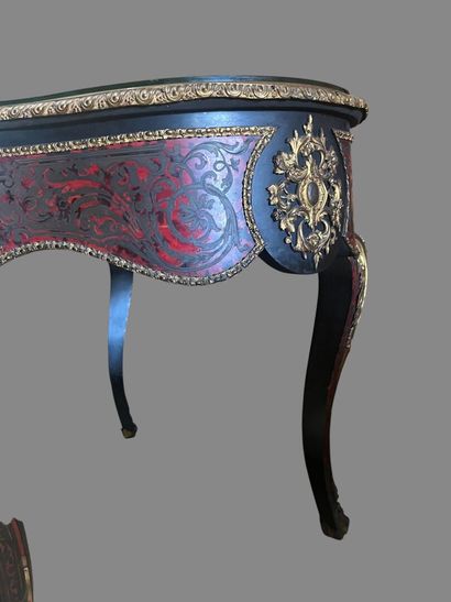 A Boulle-style red tortoiseshell veneered...