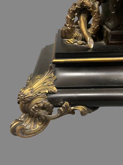 Bronze mantel clock with brown and gilded...