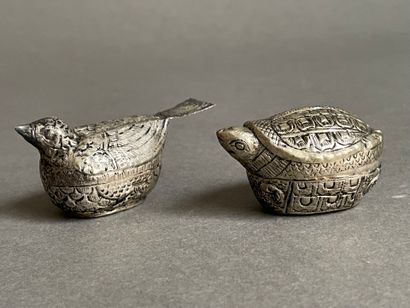 Two metal pill boxes in the shape of gourds
and...