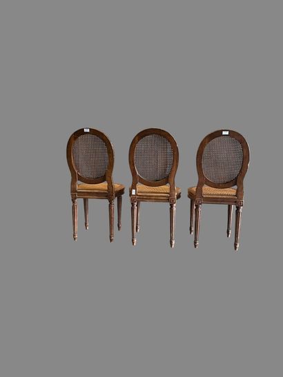 Three caned chairs in molded natural wood....
