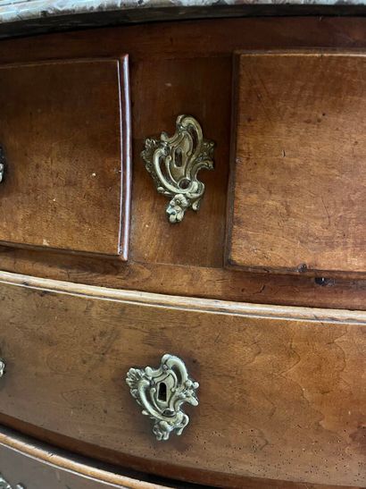 Natural wood chest of drawers with four drawers...