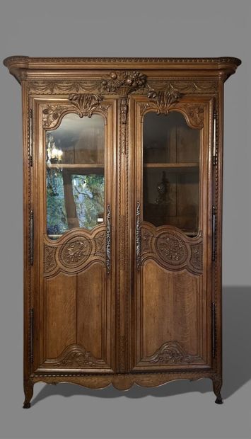Natural oak cabinet richly carved with fruit...