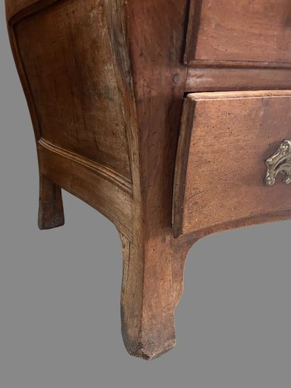 Natural wood chest of drawers with four drawers...