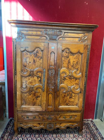 Large molded walnut armoire opening with...
