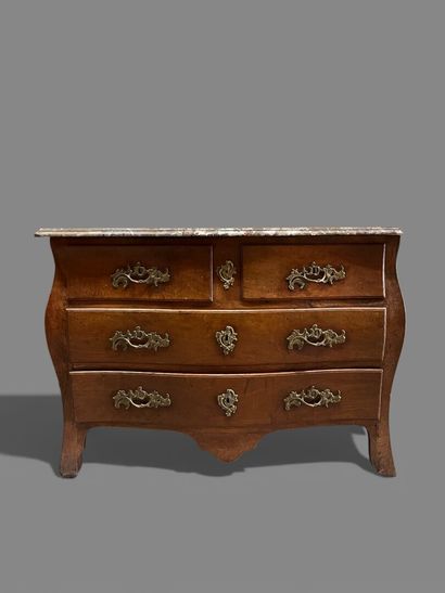 Natural wood chest of drawers with four drawers...