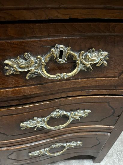 Chest of drawers in waxed oak with four molded...