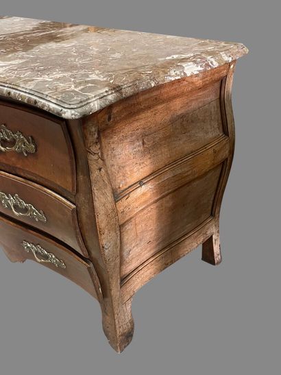Natural wood chest of drawers with four drawers...