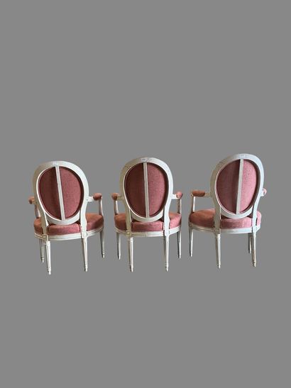 Suite of three white relacquered molded wood...