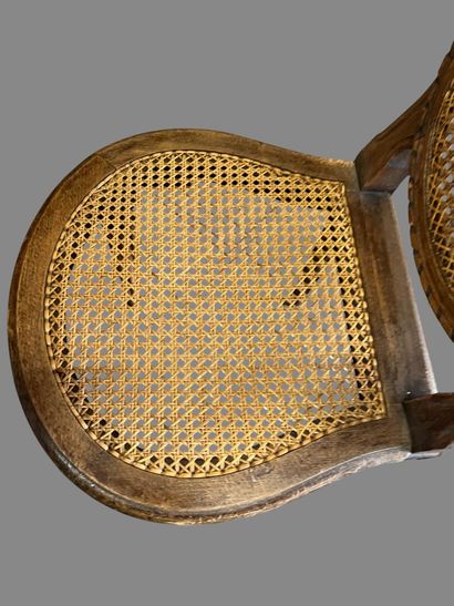 Three caned chairs in molded natural wood....