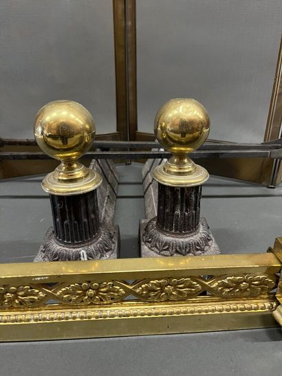 Gilt bronze hearth bar with vase decoration.
19th...