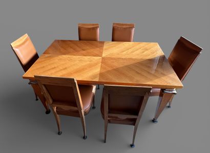 Rectangular dining room table in light wood...