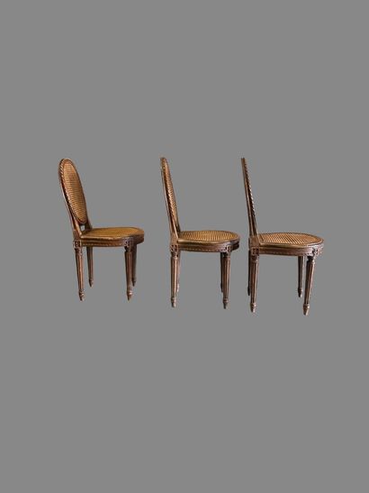 Three caned chairs in molded natural wood....