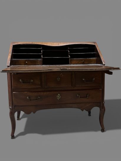 Natural wood sloping desk opening to a flap...