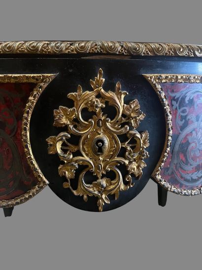 A Boulle-style red tortoiseshell veneered...
