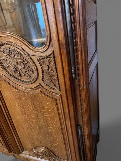 Natural oak cabinet richly carved with fruit...