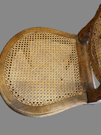 Three caned chairs in molded natural wood....