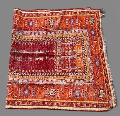 Wool carpet with Mihrab design on a red background....
