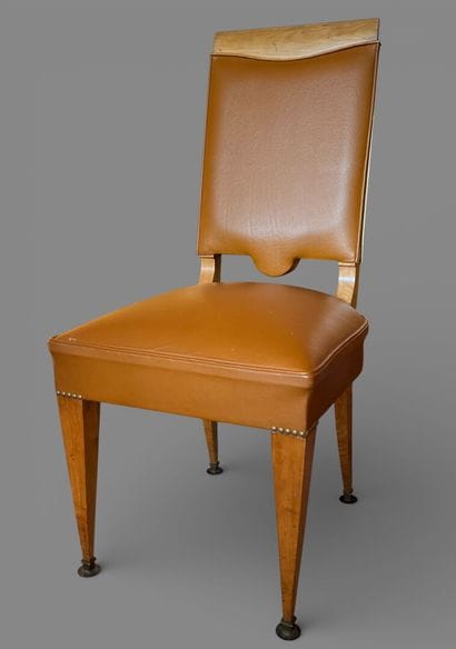 Eight chairs upholstered in camel leather.
Circa...