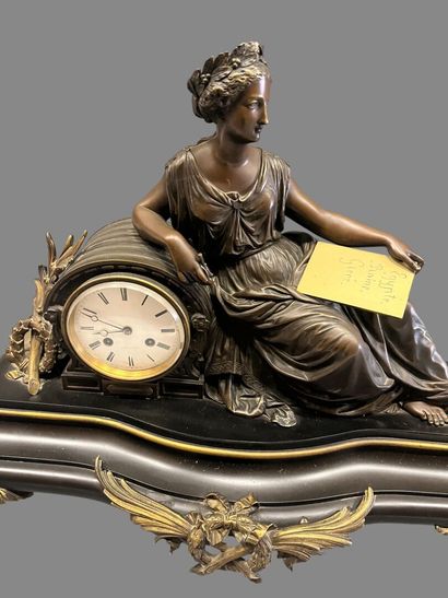 Bronze mantel clock with brown and gilded...