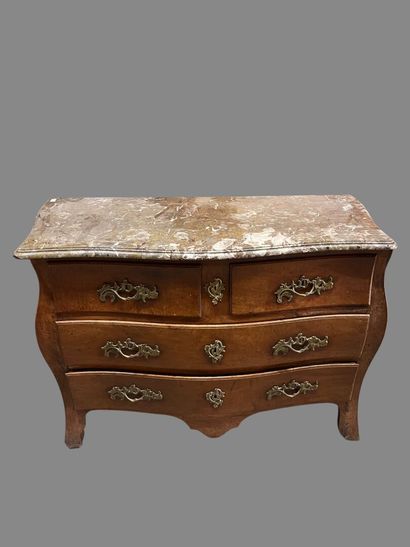 Natural wood chest of drawers with four drawers...