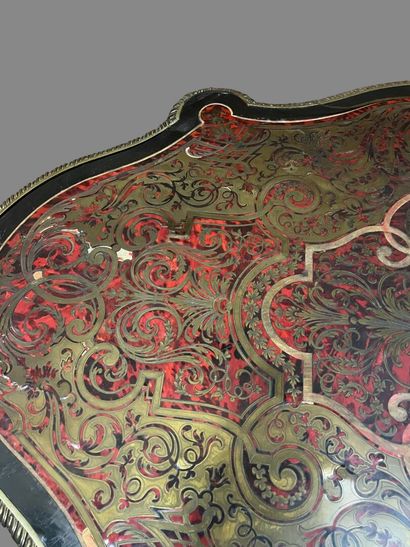 A Boulle-style red tortoiseshell veneered...