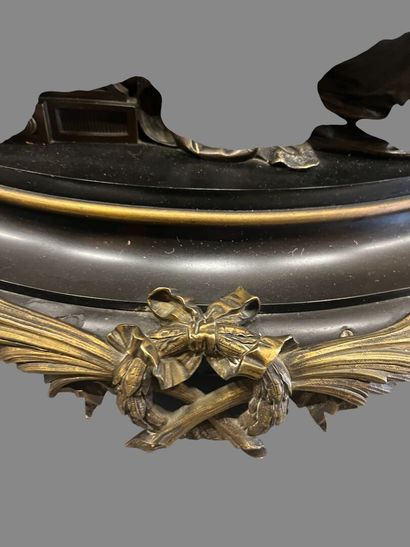 Bronze mantel clock with brown and gilded...