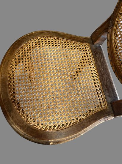 Three caned chairs in molded natural wood....