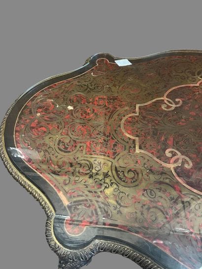 A Boulle-style red tortoiseshell veneered...