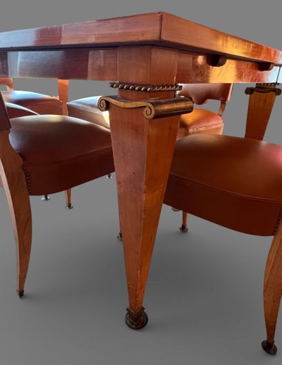 Rectangular dining room table in light wood...