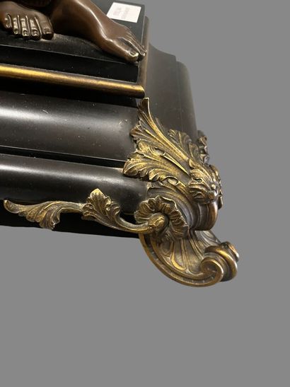 Bronze mantel clock with brown and gilded...
