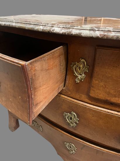 Natural wood chest of drawers with four drawers...