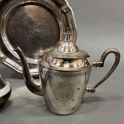 Silver-plated teapot and milk jug decorated...