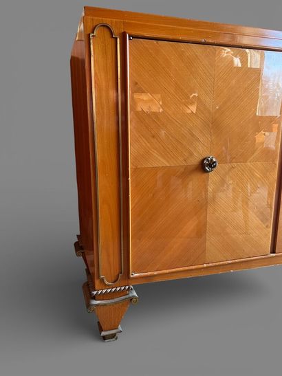 Light wood veneered sideboard opening to...