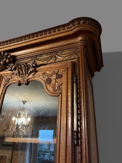 Natural oak cabinet richly carved with fruit...