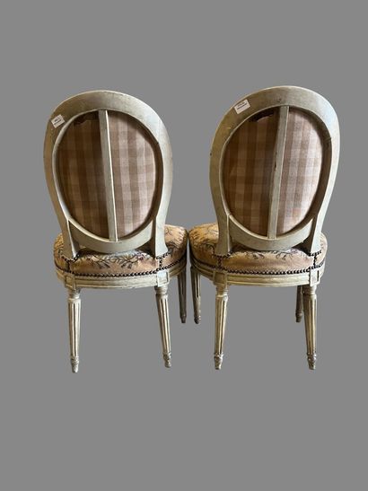 Pair of chairs in cream and molded varnished...