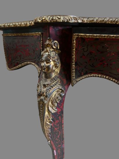 A Boulle-style red tortoiseshell veneered...