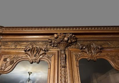 Natural oak cabinet richly carved with fruit...