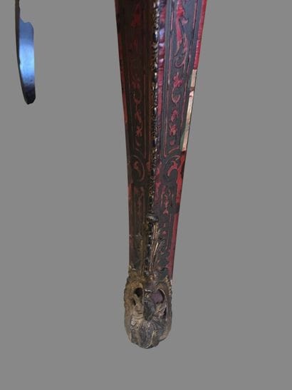 A Boulle-style red tortoiseshell veneered...