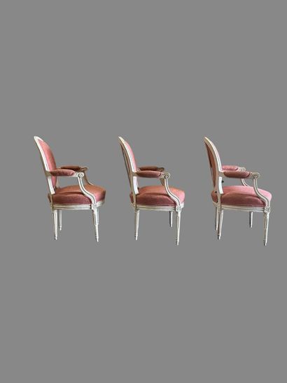 Suite of three white relacquered molded wood...
