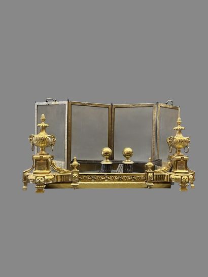 Gilt bronze hearth bar with vase decoration.
19th...