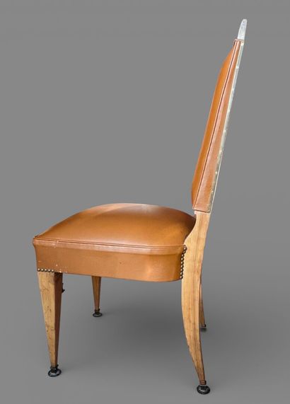 Eight chairs upholstered in camel leather.
Circa...