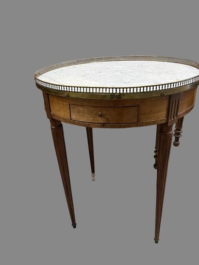 Octagonal pedestal table on canted shaft.
19th...