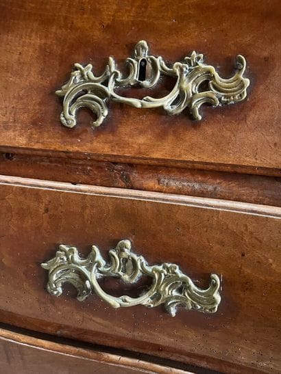 Natural wood chest of drawers with four drawers...
