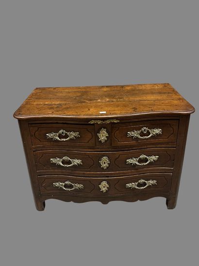 Chest of drawers in waxed oak with four molded...